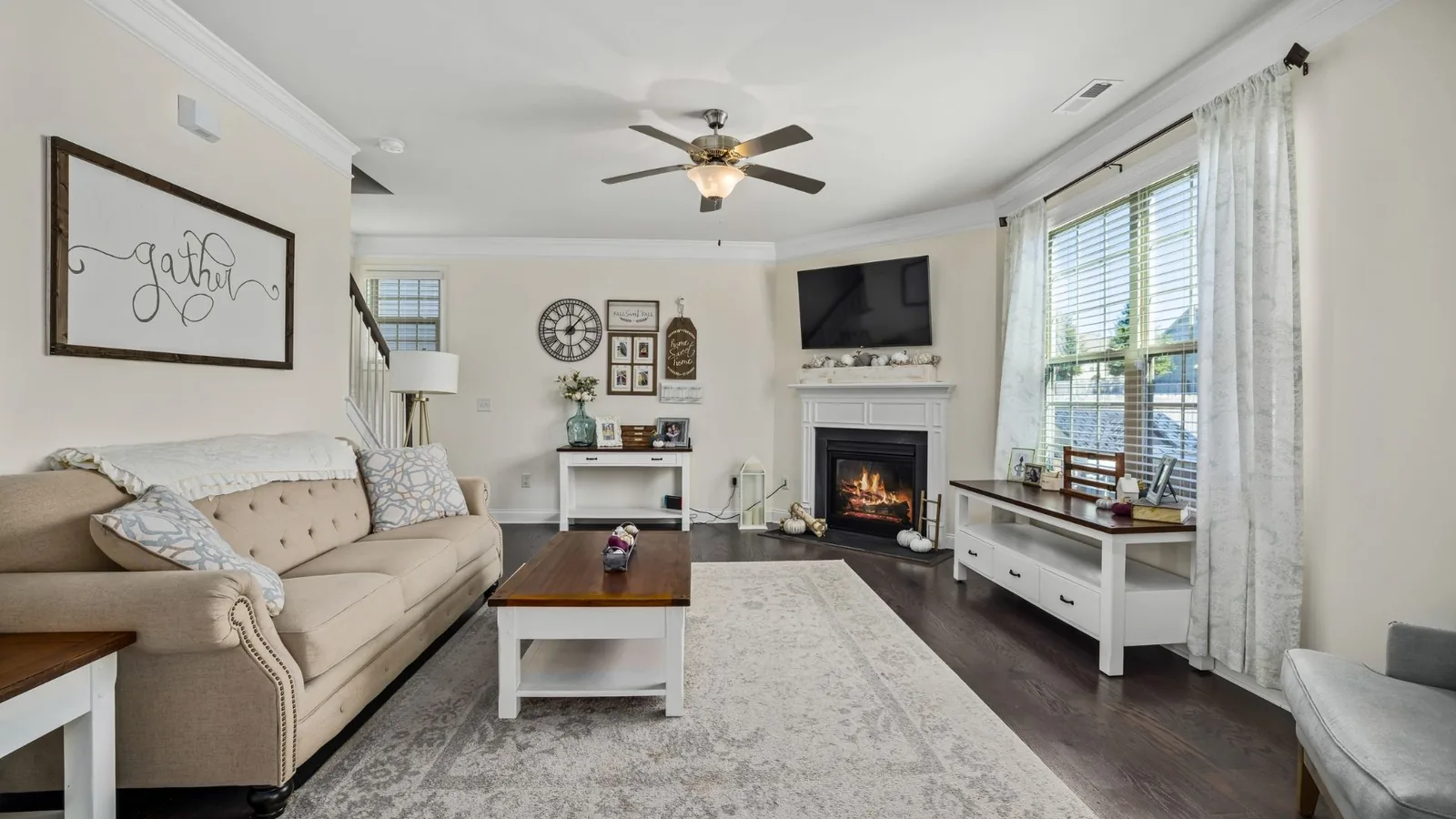 Clean living room with fireplace and sofa