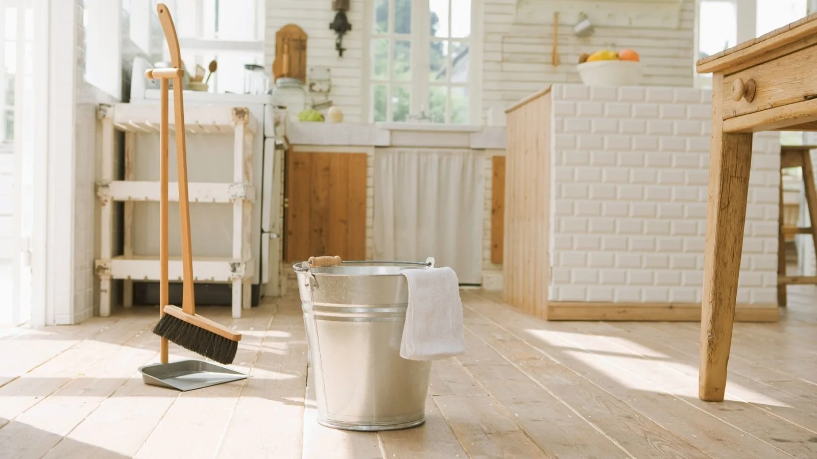Bucket and broom setup in a freshly cleaned kitchen