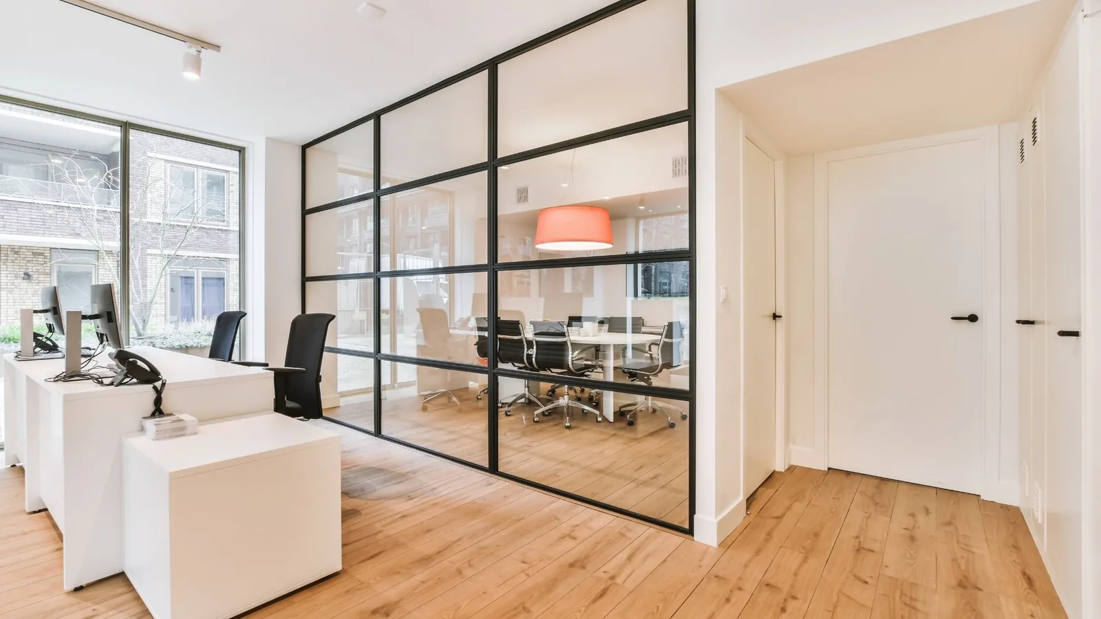 Clean modern office lobby and glass meeting room